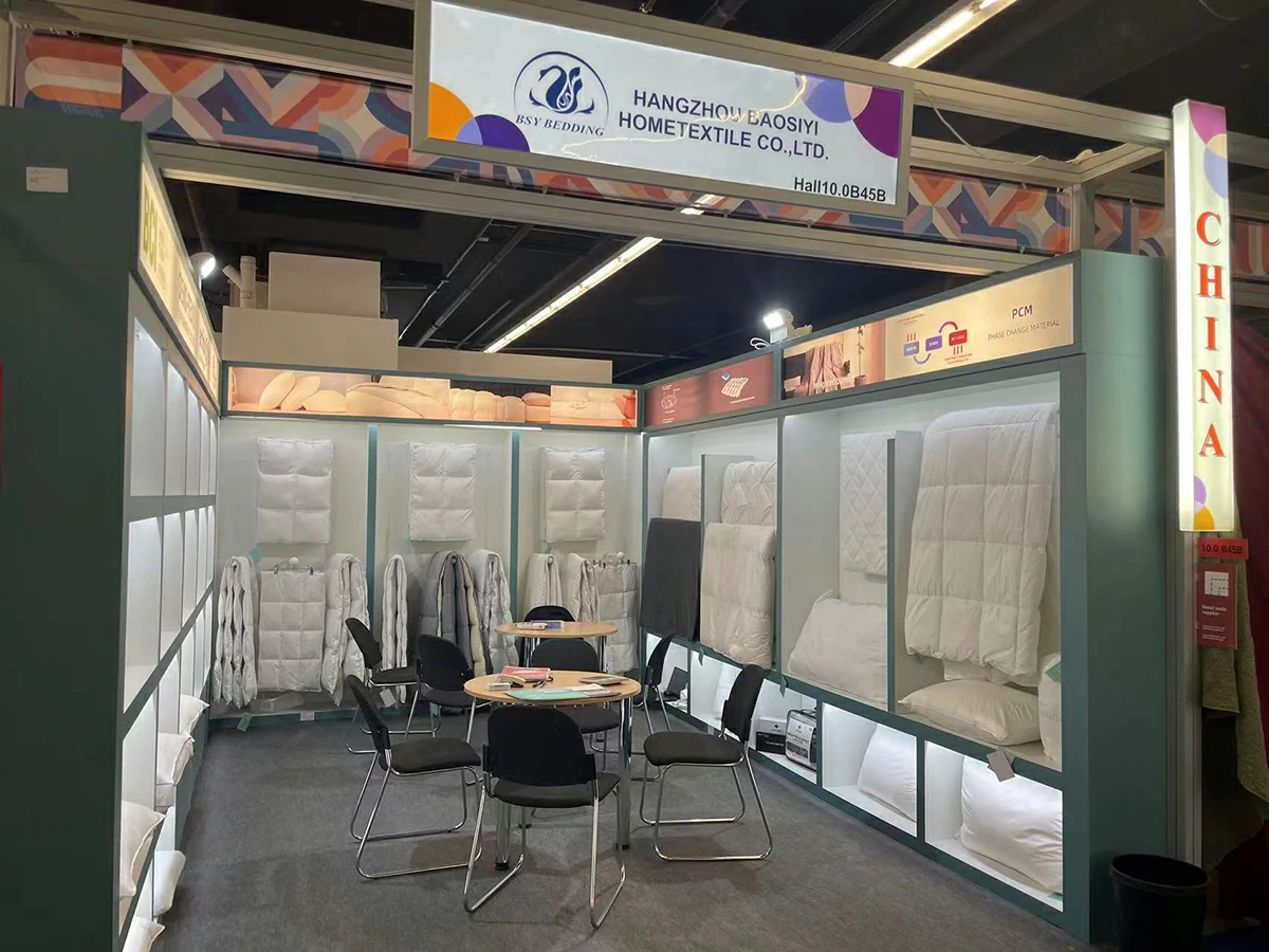 Hangzhou Baosiyi Hometextile exhibition booth showcasing duvet and pillow collections