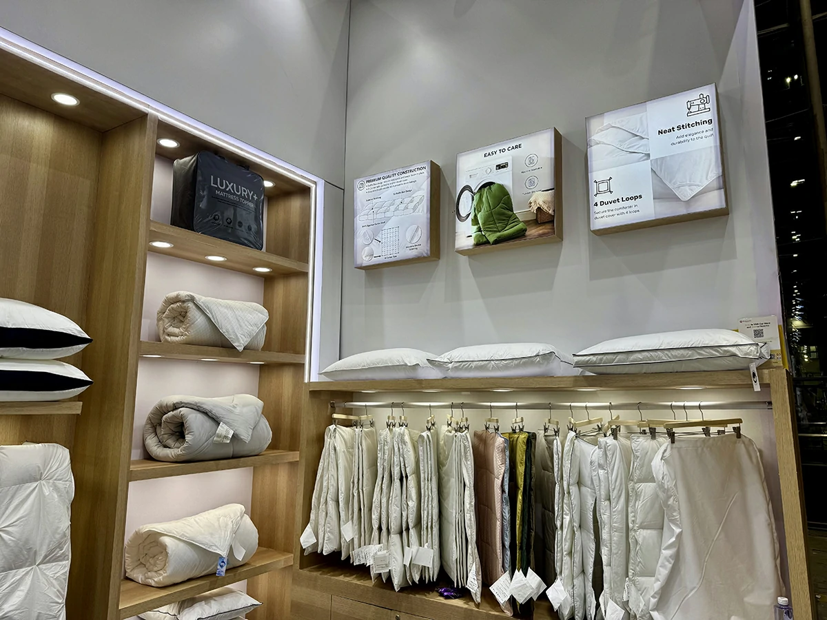 Premium down duvet and pillow showroom display shelves at international expo